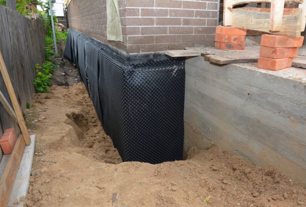 Happy homeowners after waterproofing job in Port Washington